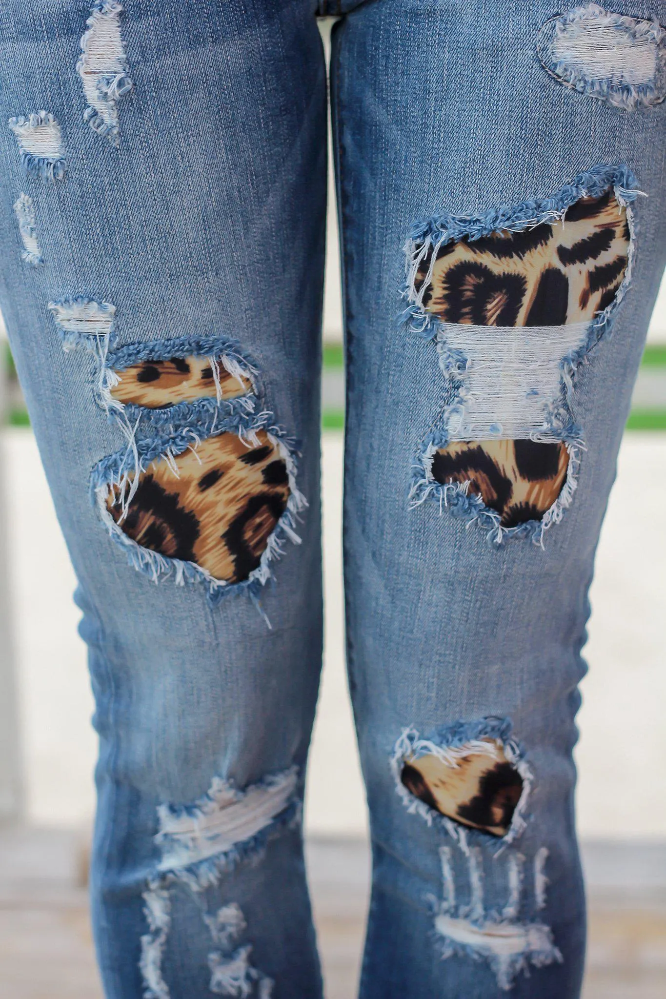 Distressed Denim Jeans with Leopard Print Detail