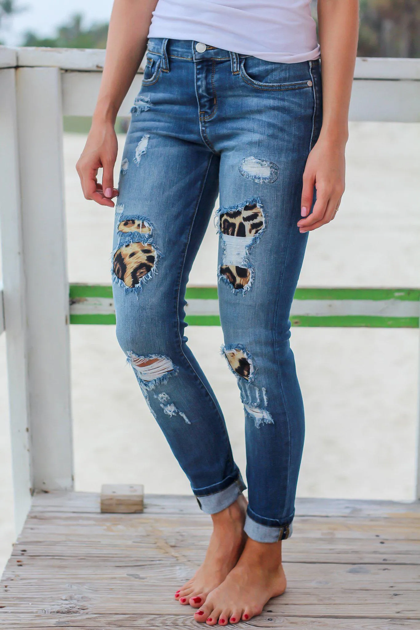 Distressed Denim Jeans with Leopard Print Detail